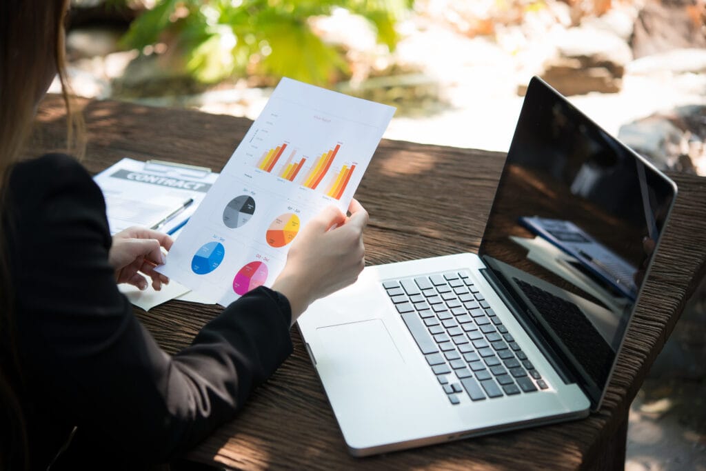 business woman working with documents graphs ,analyzing investm
